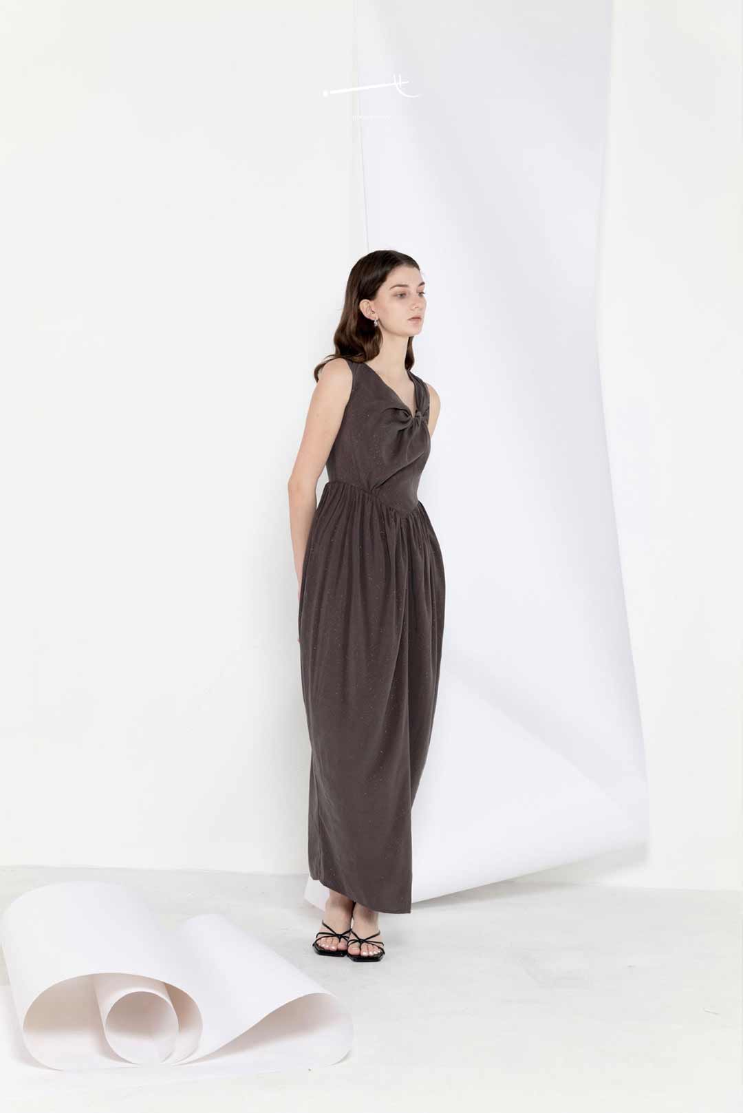 Model wearing star-pleated flower-pod
long dress