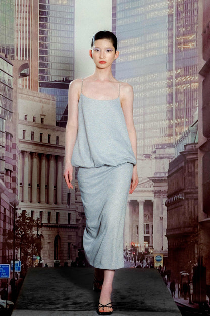 Model in blue silver camisole and fitted
skirt