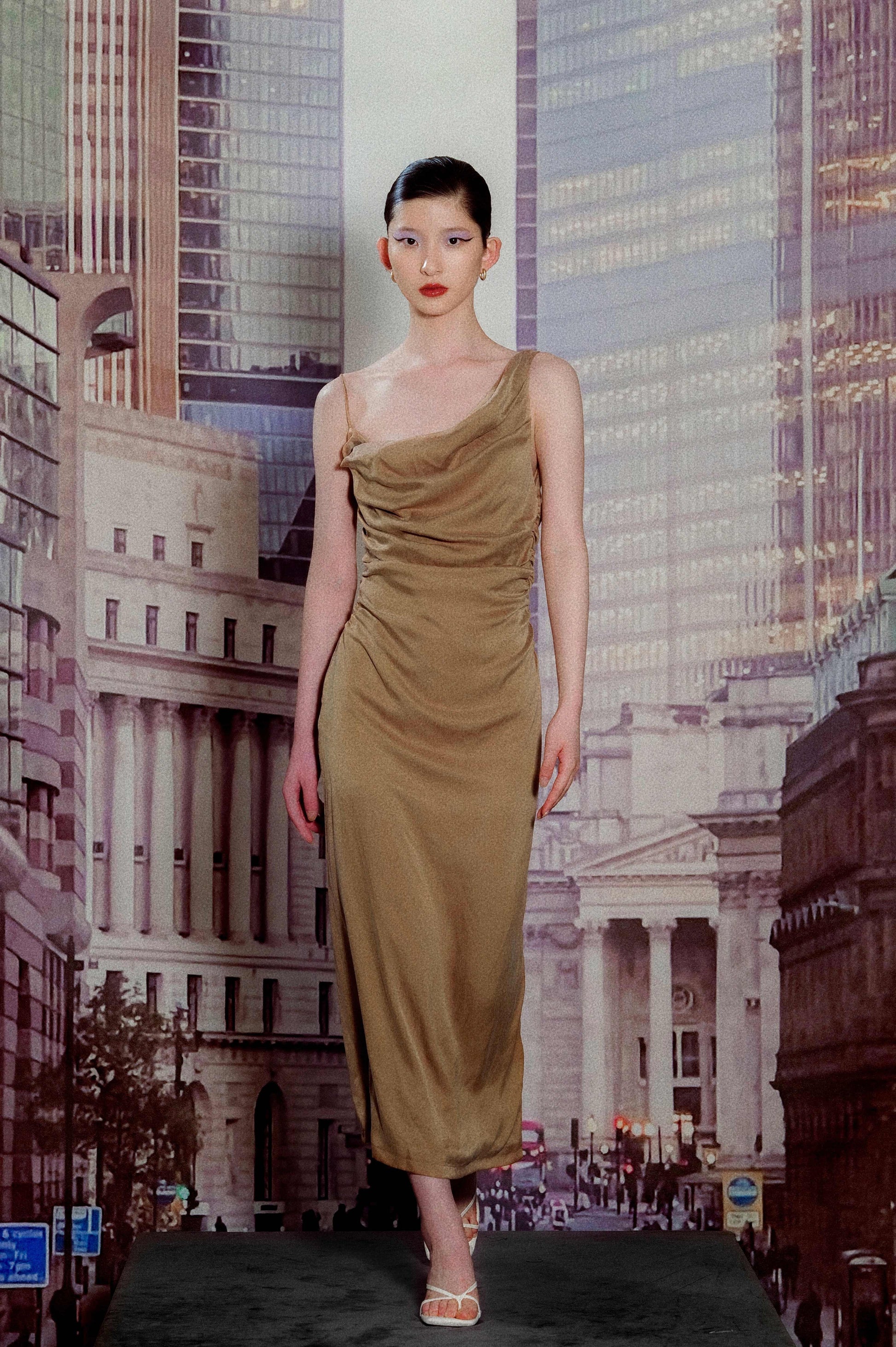Model wearing copper-tone pleated maxi dress
