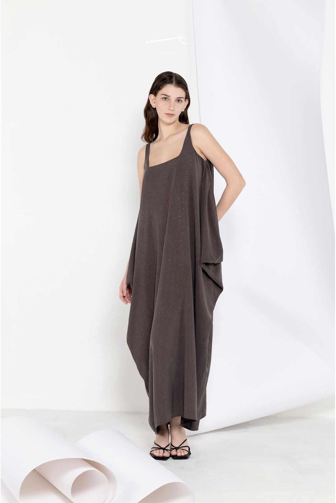 Model in a long breezy sleeveless dress
in linen tencel blend
