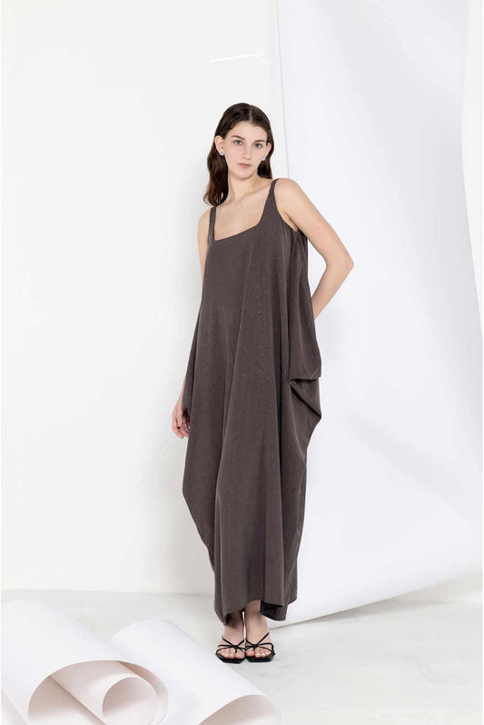 Model in a long breezy sleeveless dress
in linen tencel blend