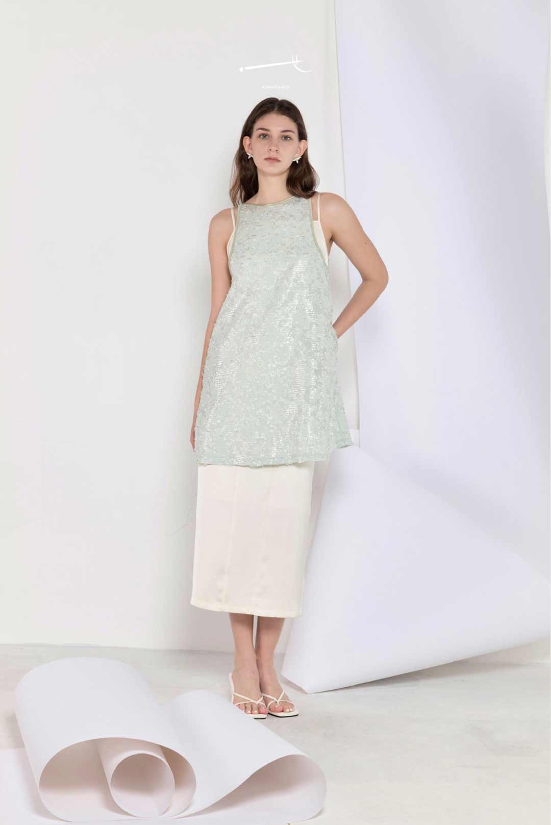 Model wearing mint sequin jacquard
a-line skirt top