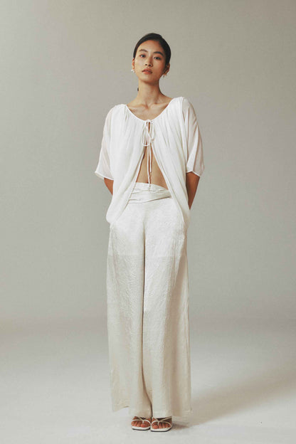 Model wearing light cardigan with
water-drop beads and half sleeves