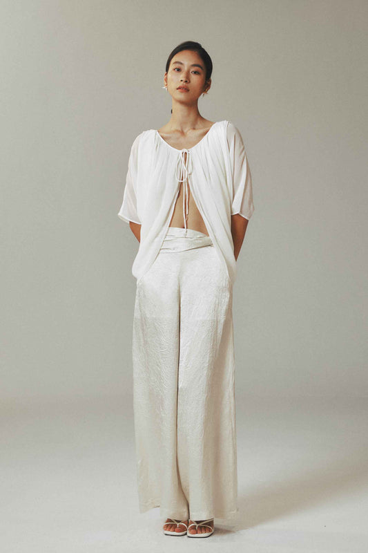 Model wearing light cardigan with
water-drop beads and half sleeves