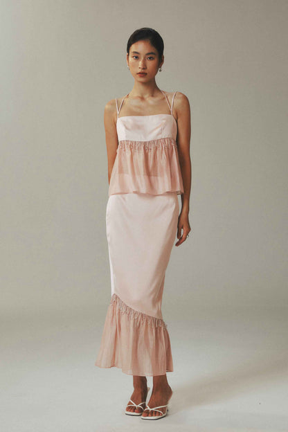 Model wearing halter crop top and skirt with
crystal bead detailing in ice-silk fabric