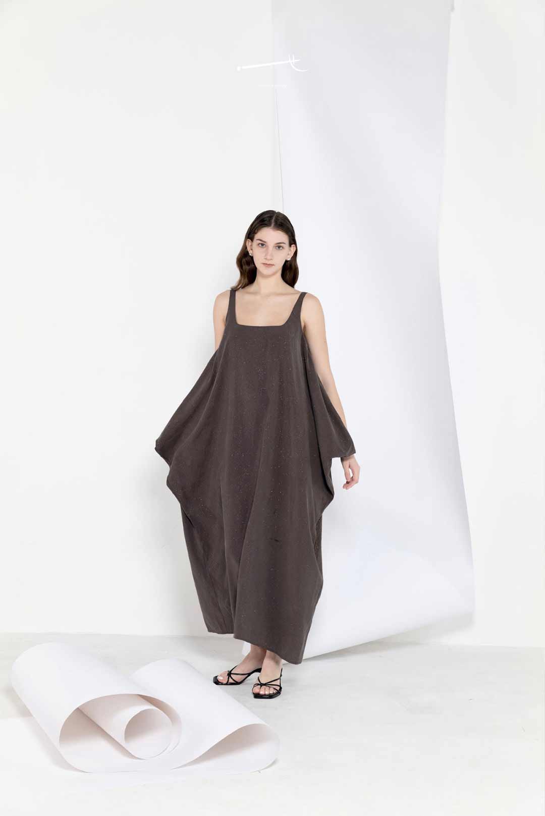Model in a long breezy sleeveless dress
in linen tencel blend