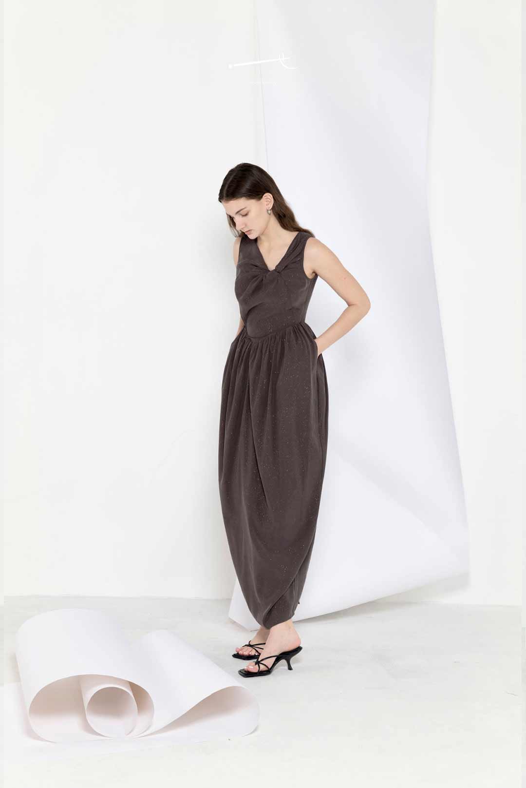 Model wearing star-pleated flower-pod
long dress