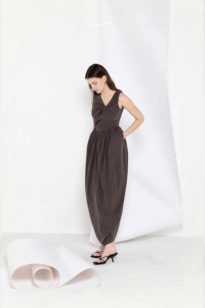 Model wearing star-pleated flower-pod
long dress