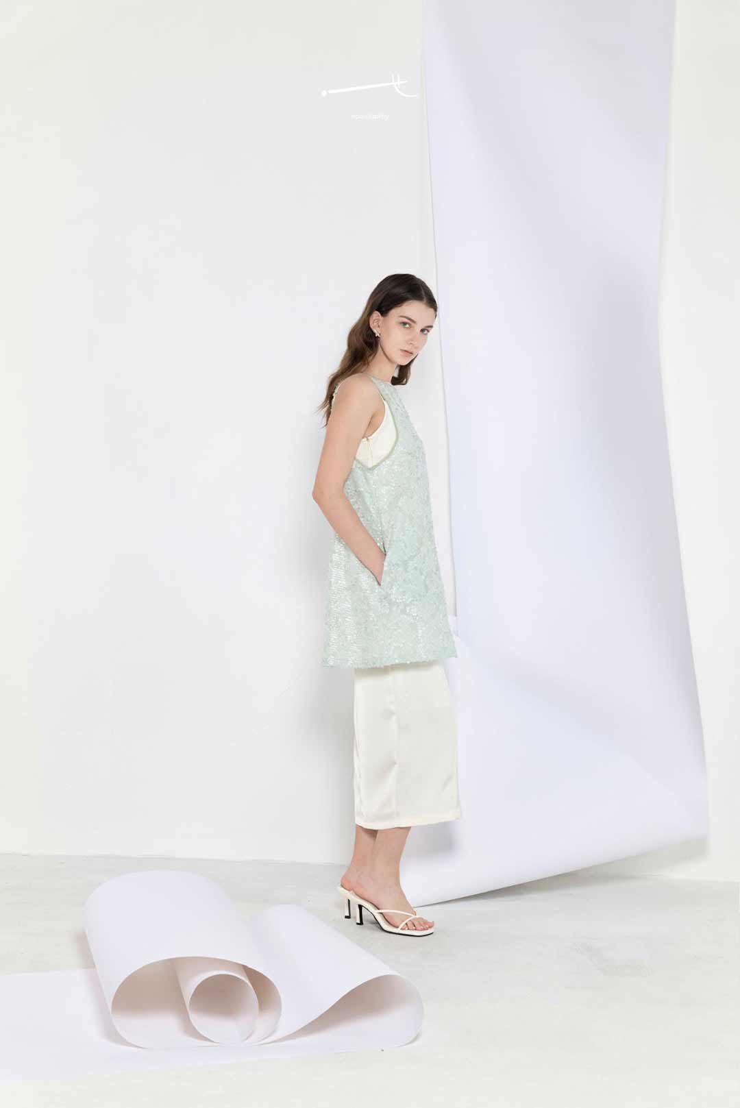 Model wearing mint sequin jacquard
a-line skirt top