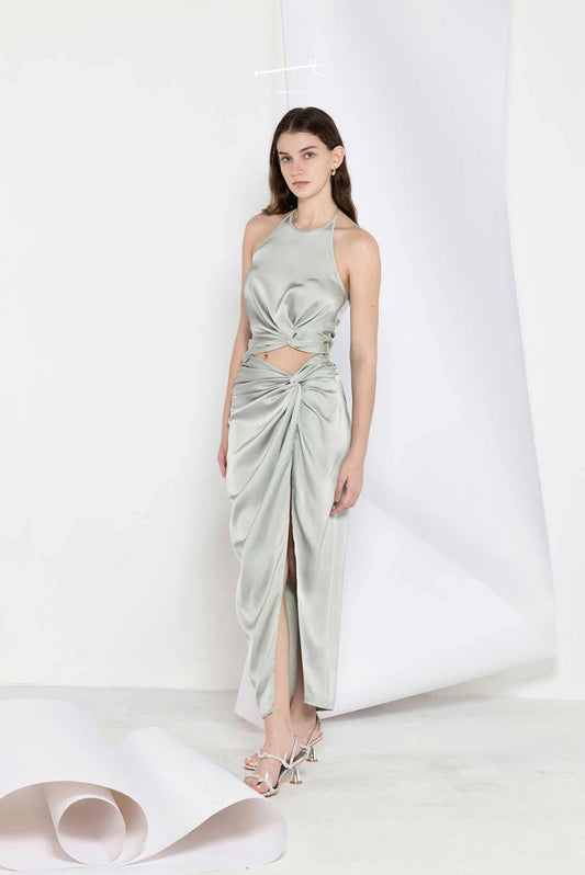 Model wearing Mediterranean-inspired
strapless top and skirt set draped texture